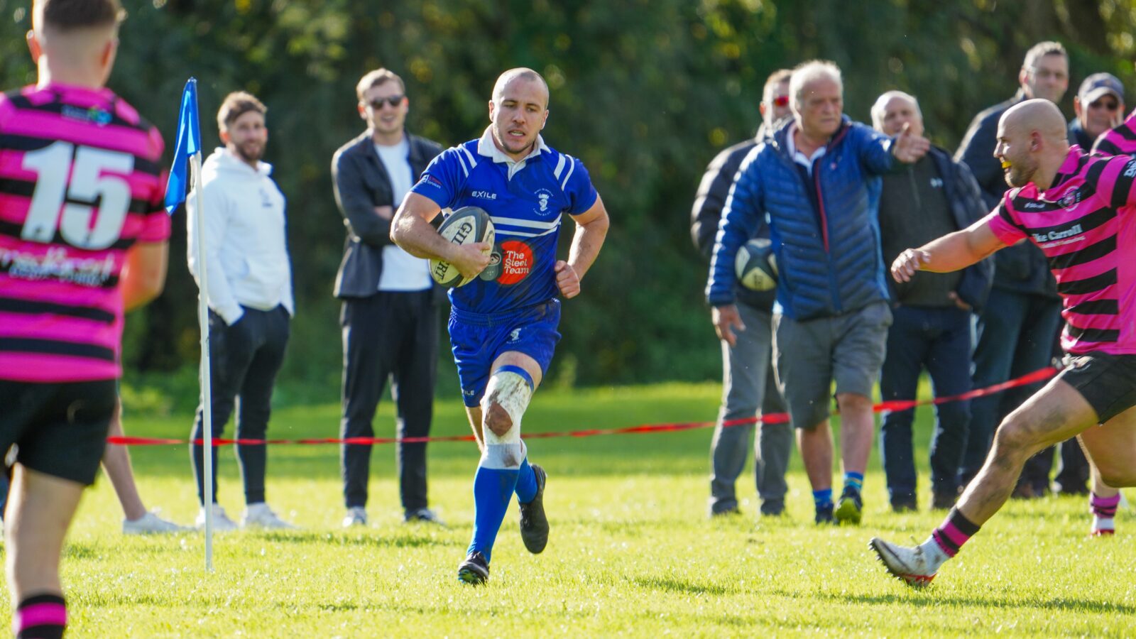 Man running with rugby ball