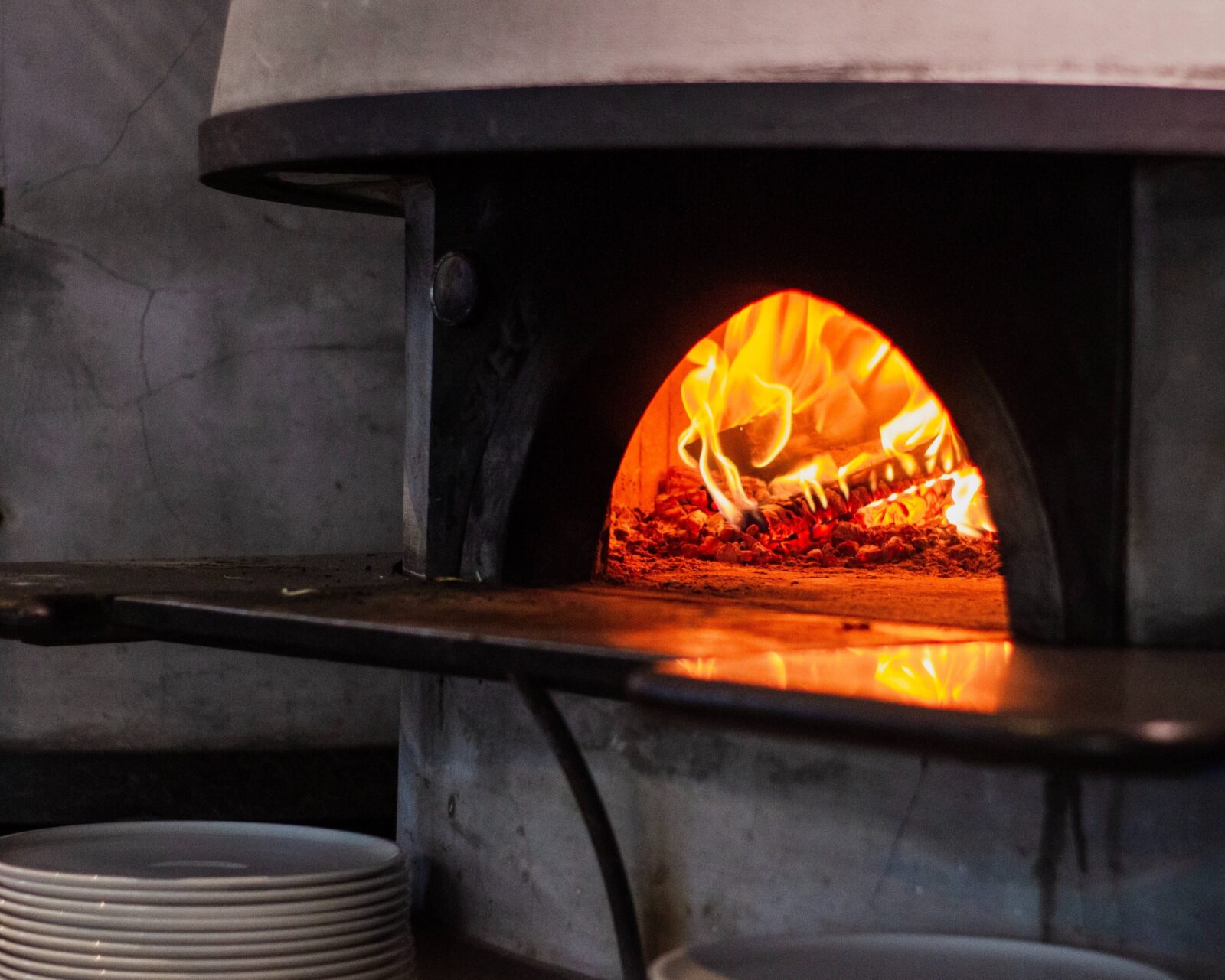 Clay oven with lit fire inside