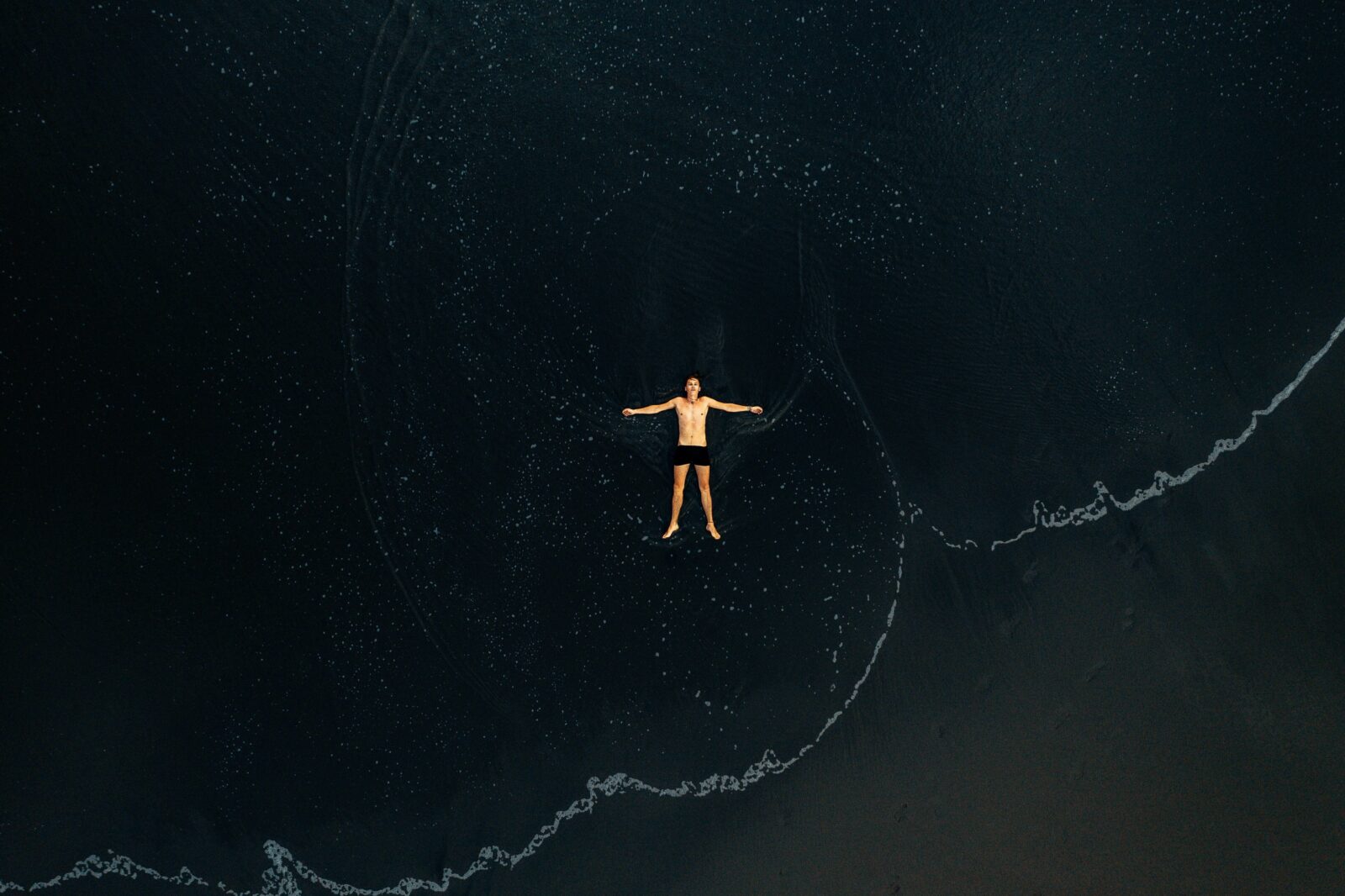 Man floating in sea